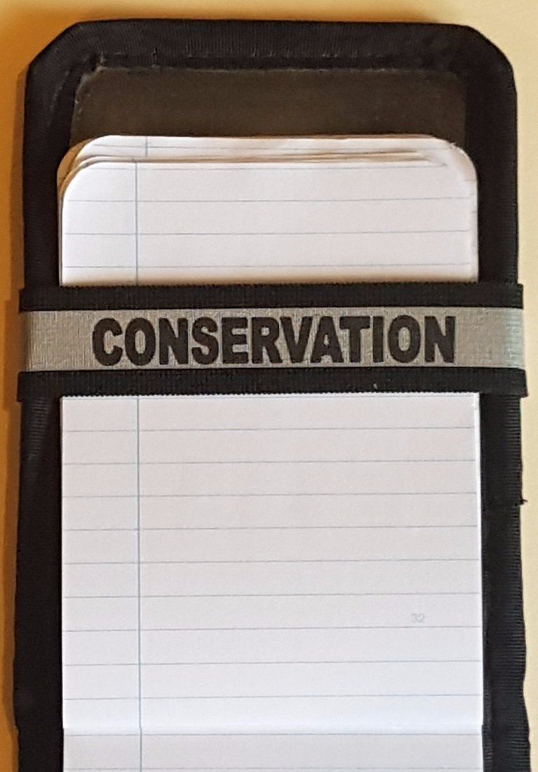 A Notebands™ for your Duty Notebook with the word conservation on it
