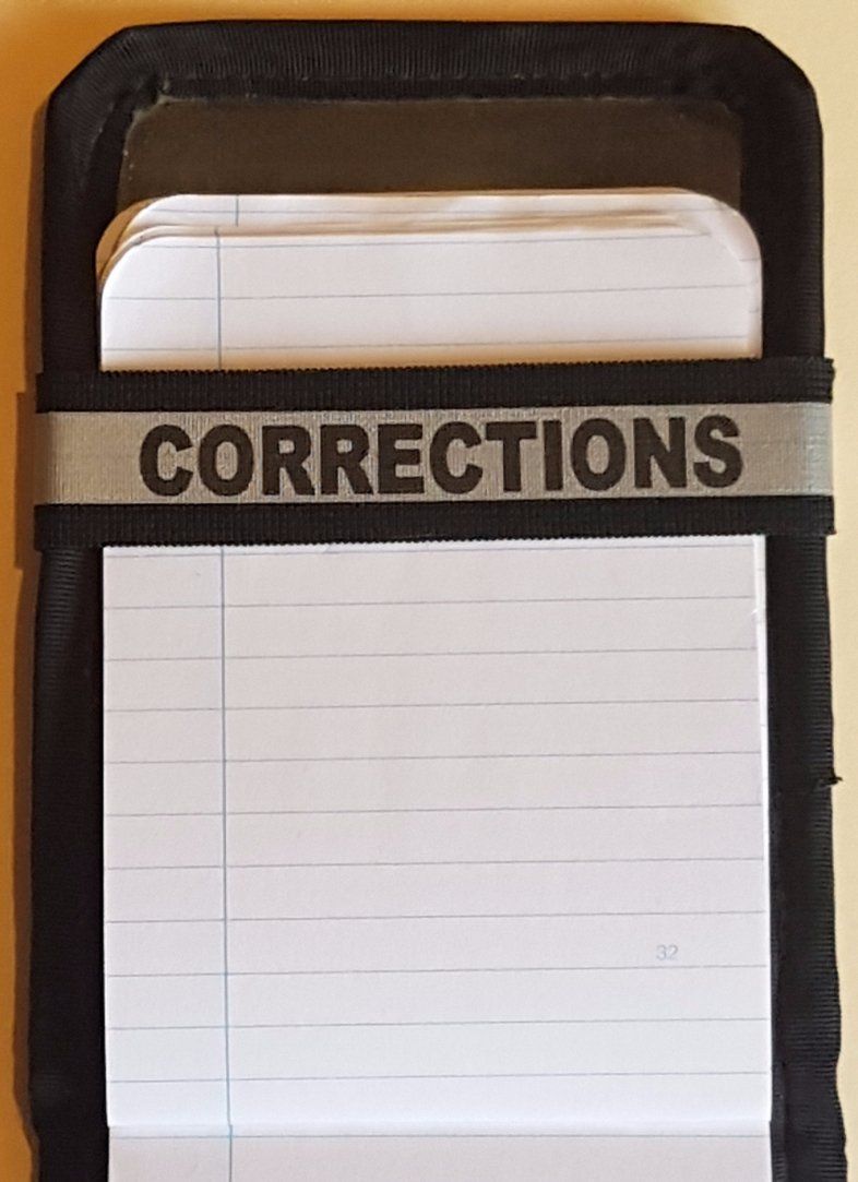 A Notebands™ for your Duty Notebook with the word corrections on it