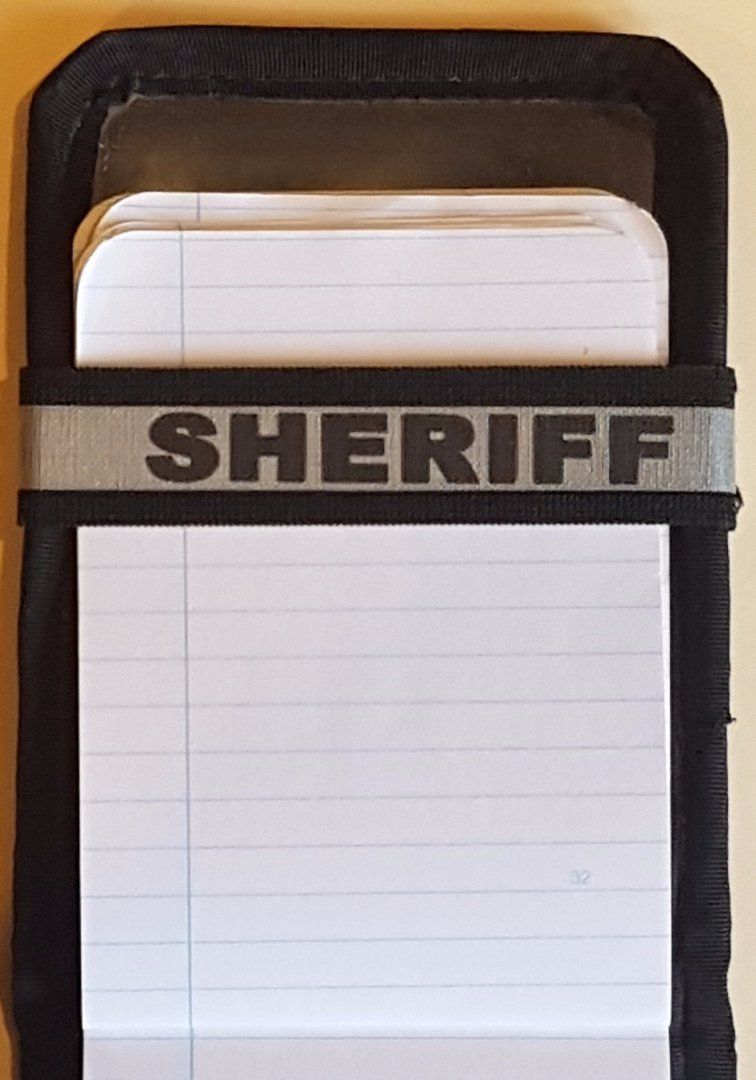 A Notebands™ for your Duty Notebook with the word sheriff on it