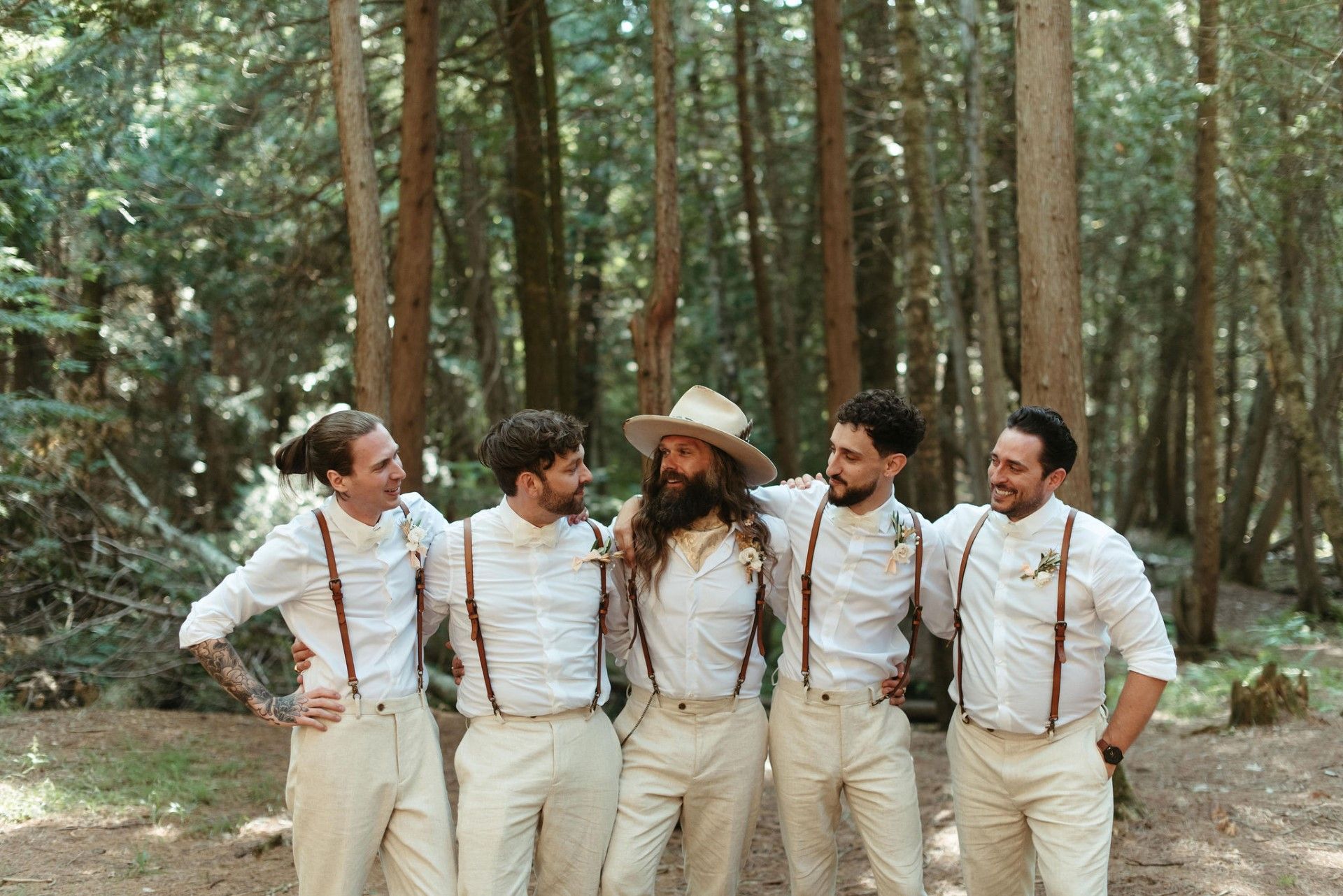Groomsmen at forest wedding at Whispering Springs Wilderness Retreat