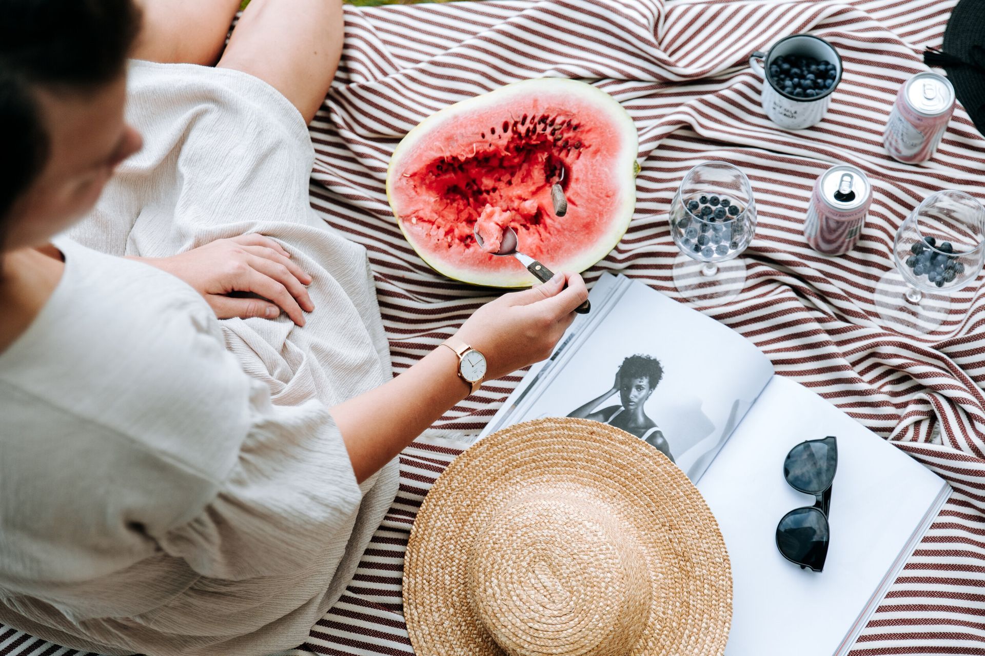 Eating from watermelon while glamping
\