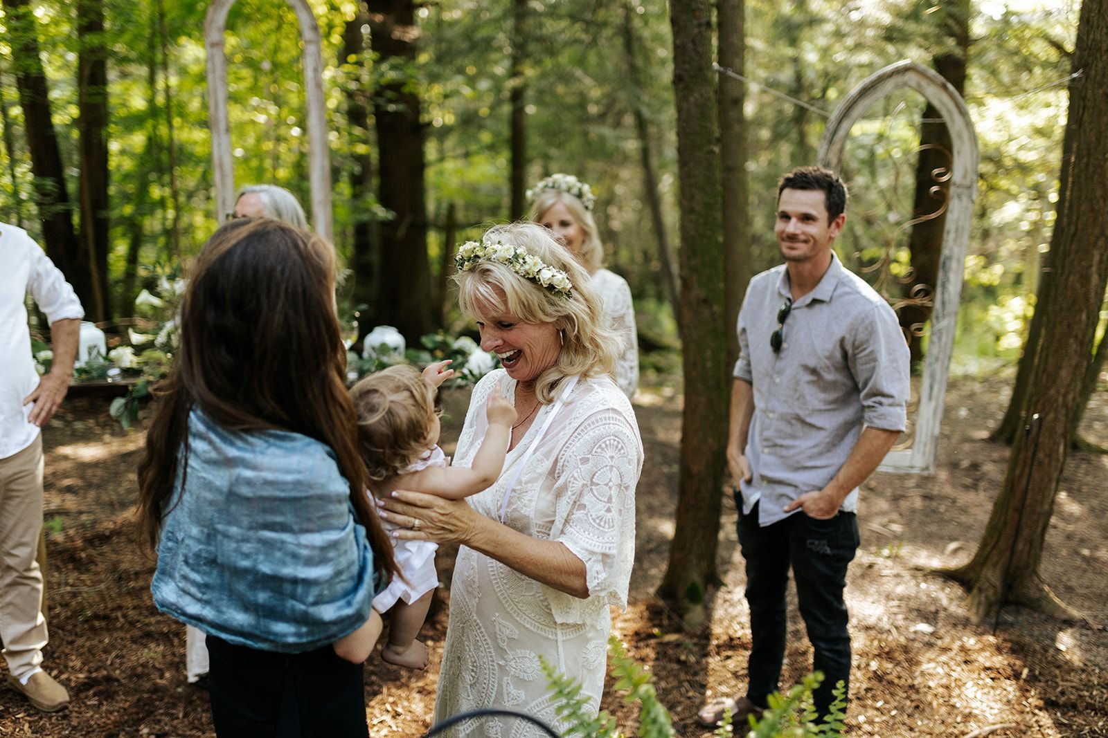 A couple says elopement weddiing vows in the beautiful forest chapel at Whispring Springs Wilderness Retreat