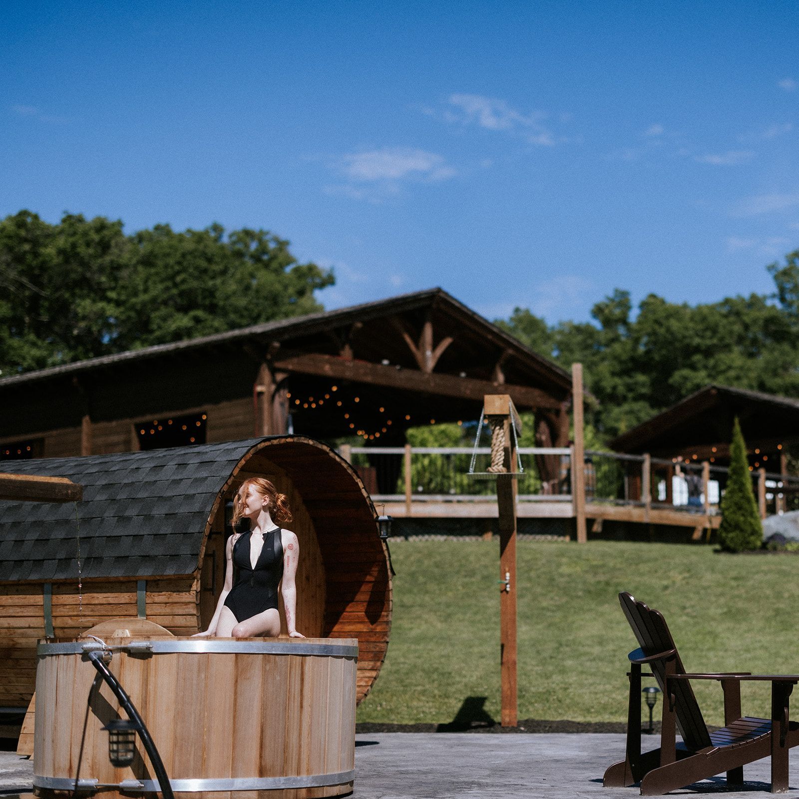 Hot tub in front of sauna wellness offering Whispering Springs