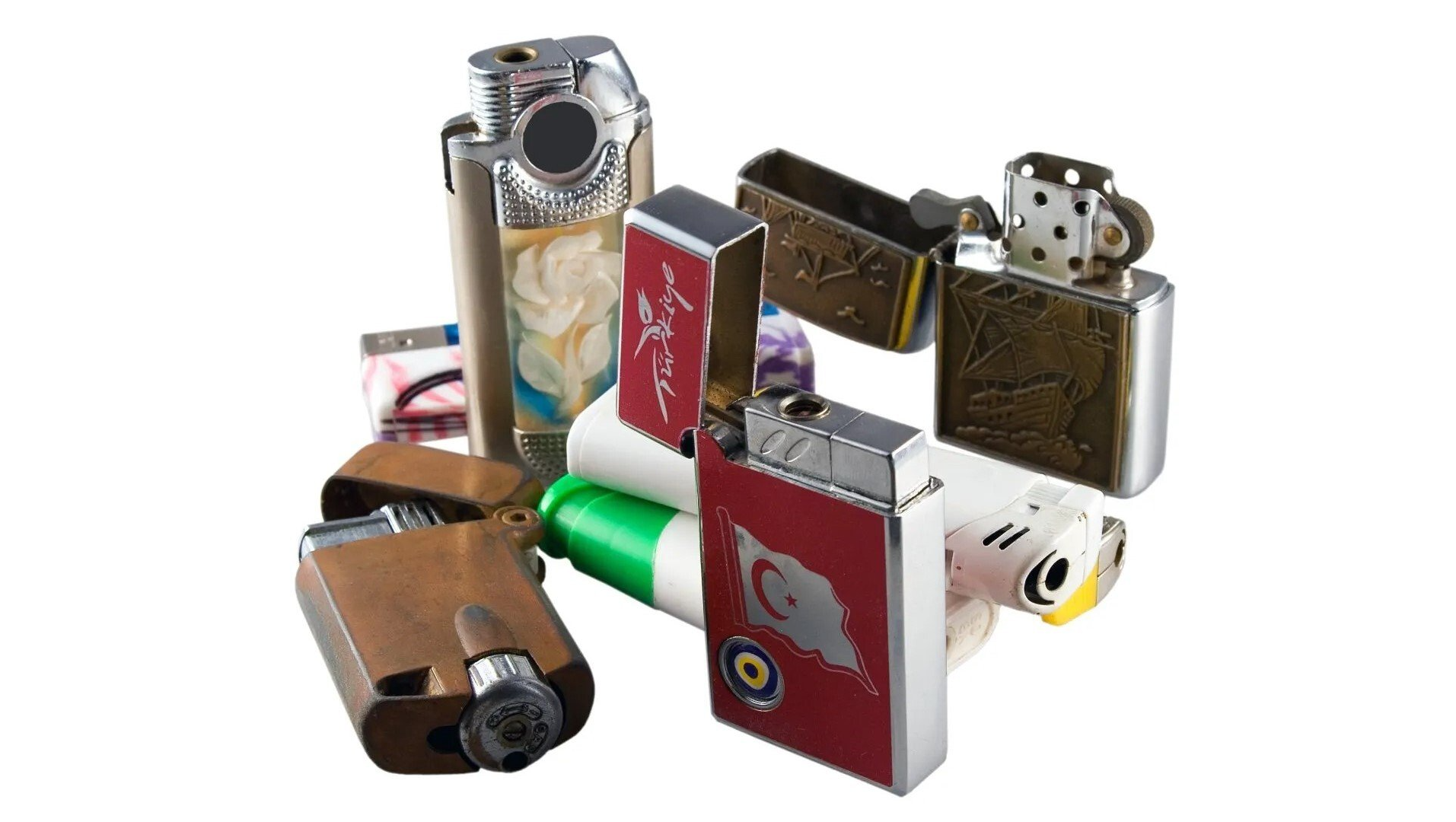 Combustible Materials — Lewisville, TX — AAA Recycling, Inc. A pile of various lighters, in silver, gold, and red with details like floral designs.
