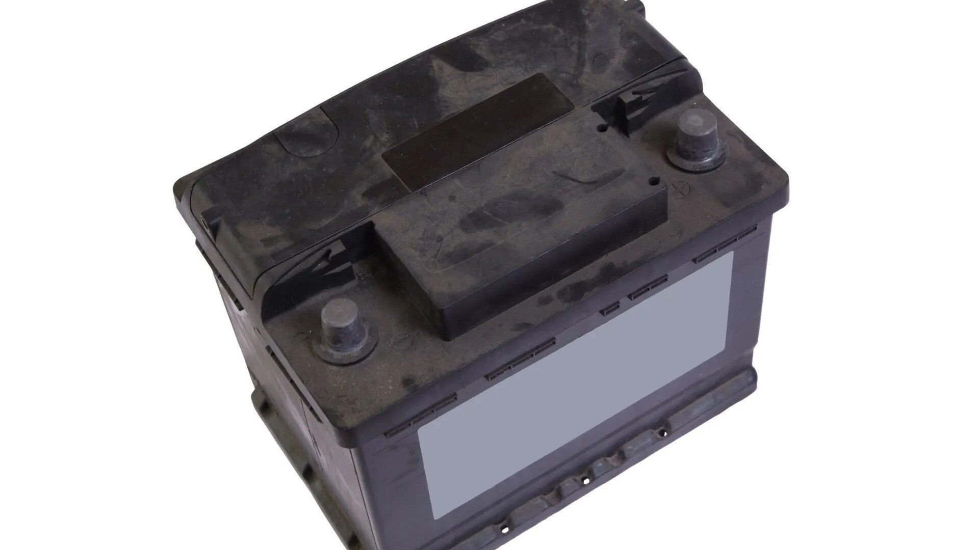 Broken Battery — Lewisville, TX — AAA Recycling, Inc. Car battery, black plastic with terminal posts, blank label, top-down view.
