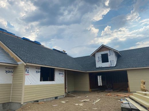 New fiber cement siding installation on residential home