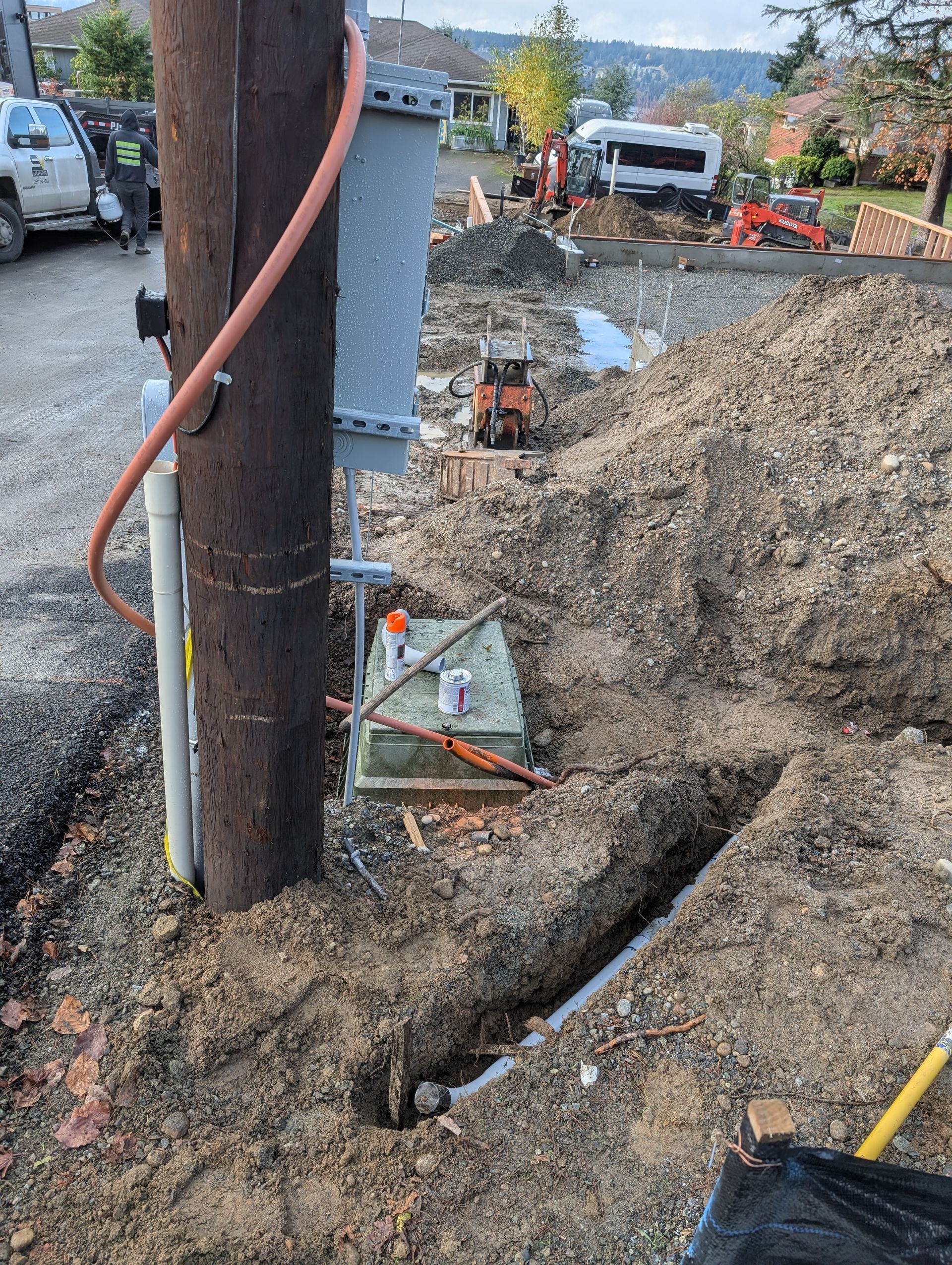 A hose is connected to a pole in the dirt.