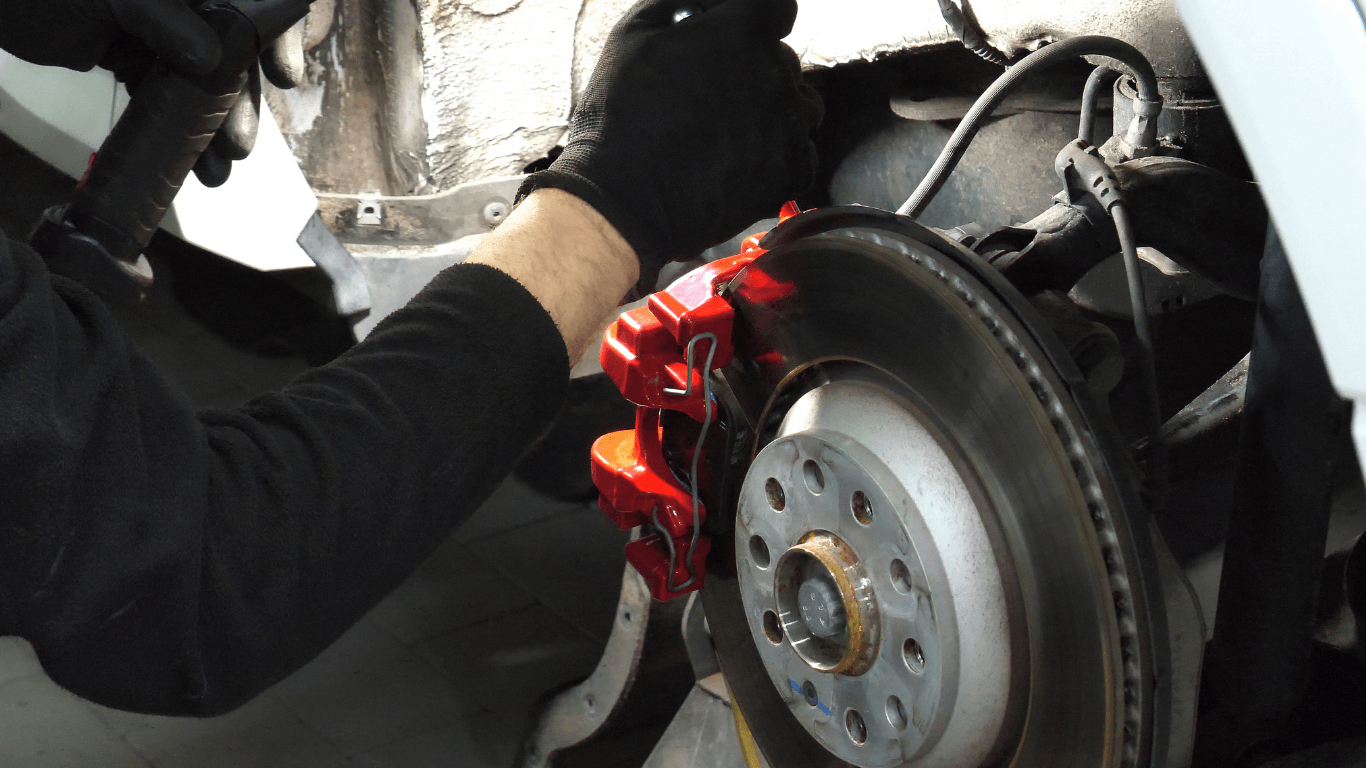 a picture of mechanic doing brake repair
