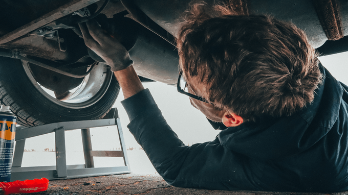 a mechanic doing a car repair