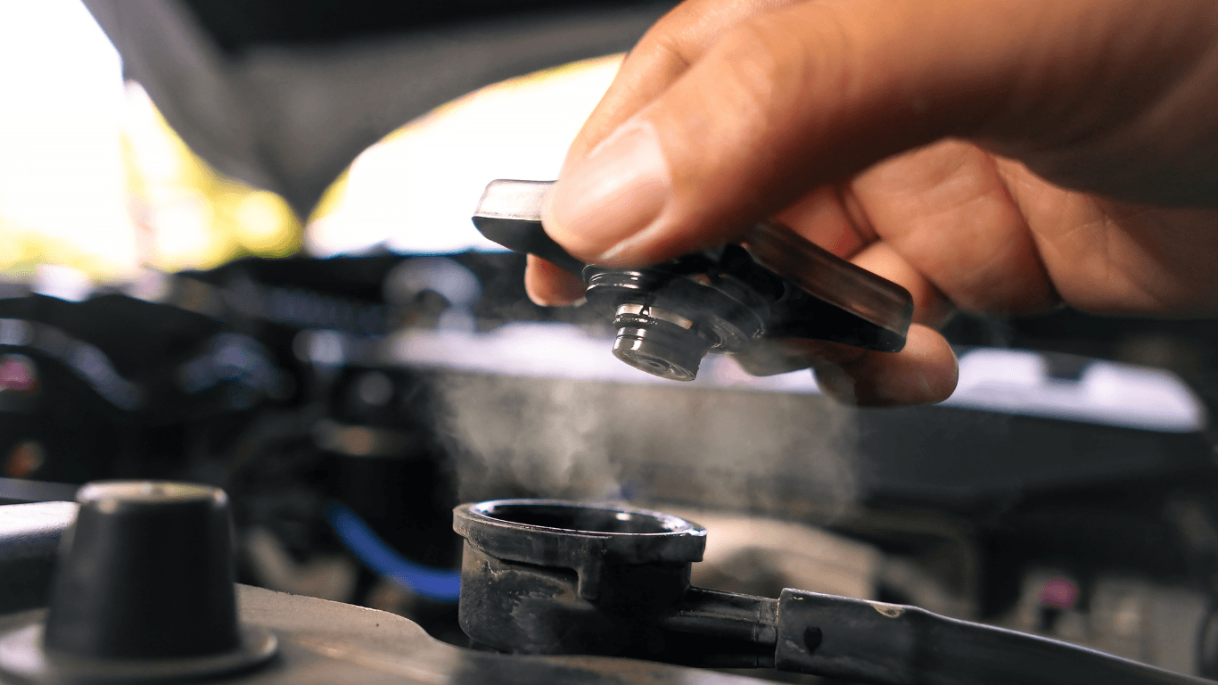 A mechanic checking an overheating car