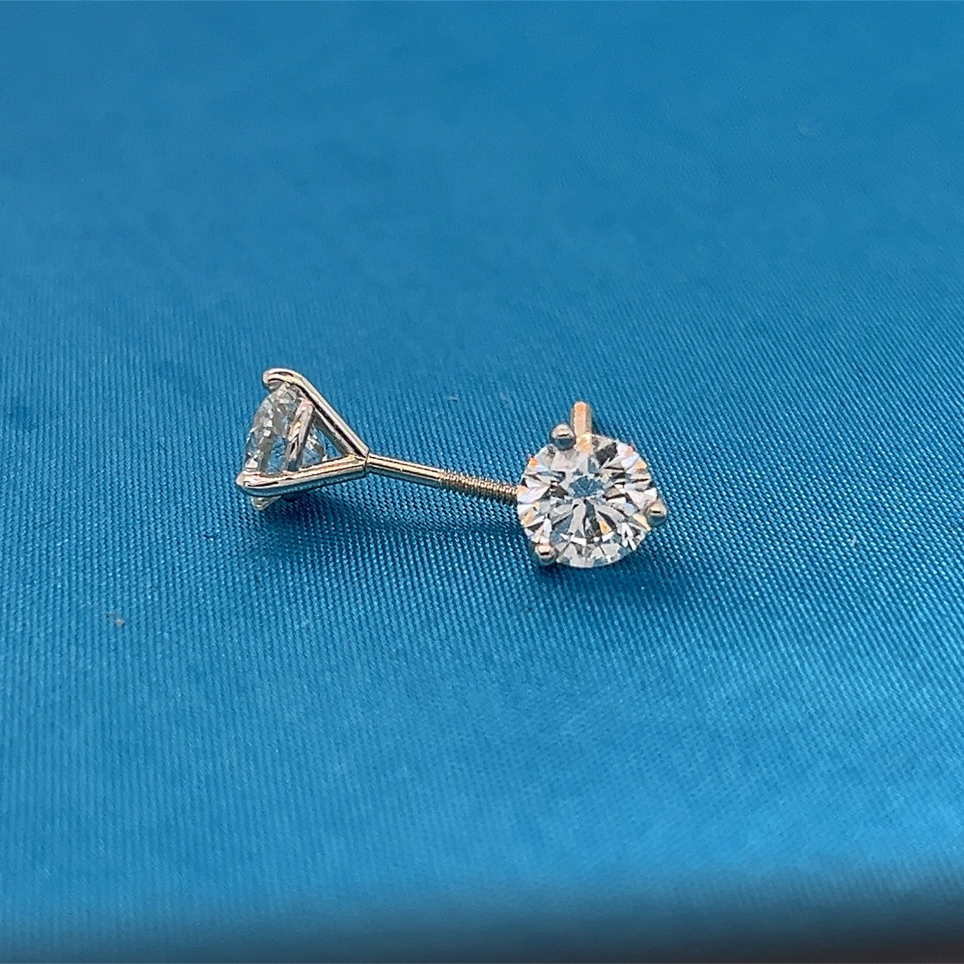 Pair of small round diamond stud earrings