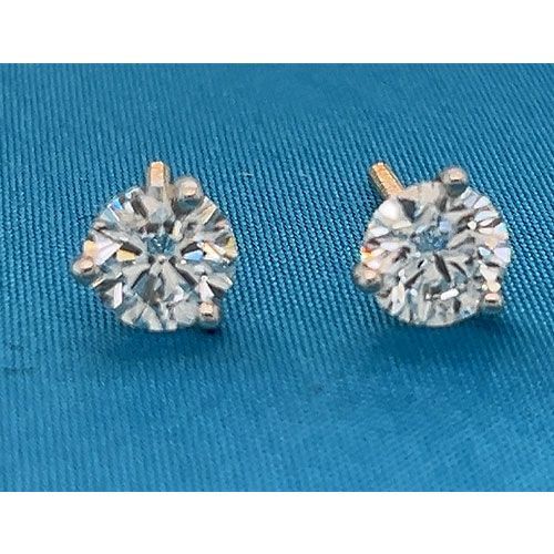 Pair of small round diamond stud earrings