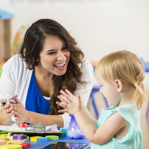 Child and Her Teacher — Kankakee, IL — Lasting Impressions Learning Centers Child and Her Teacher — Kankakee, IL — Lasting Impressions Learning Centers