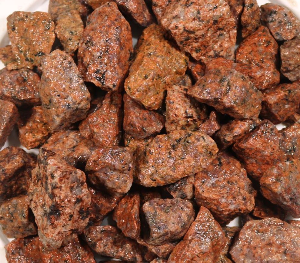 A pile of rocks is sitting on a white plate.