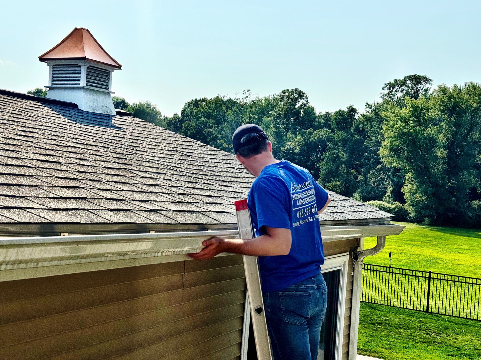 Advanced Seamless Gutters repairing an old gutter.