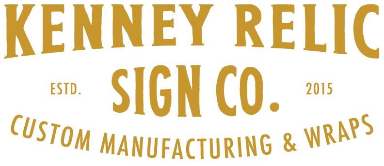 Logo for Kenney Relic Sign Co., with gold text on a white background. It says, 