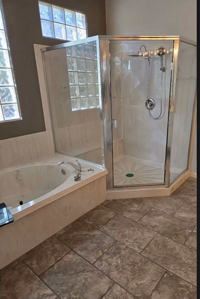 A bathroom with a toilet a sink and a bathtub