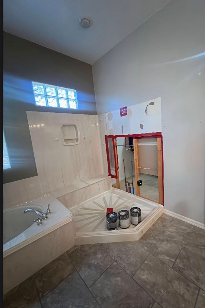 A bathroom sink is being remodeled with a hole in the floor