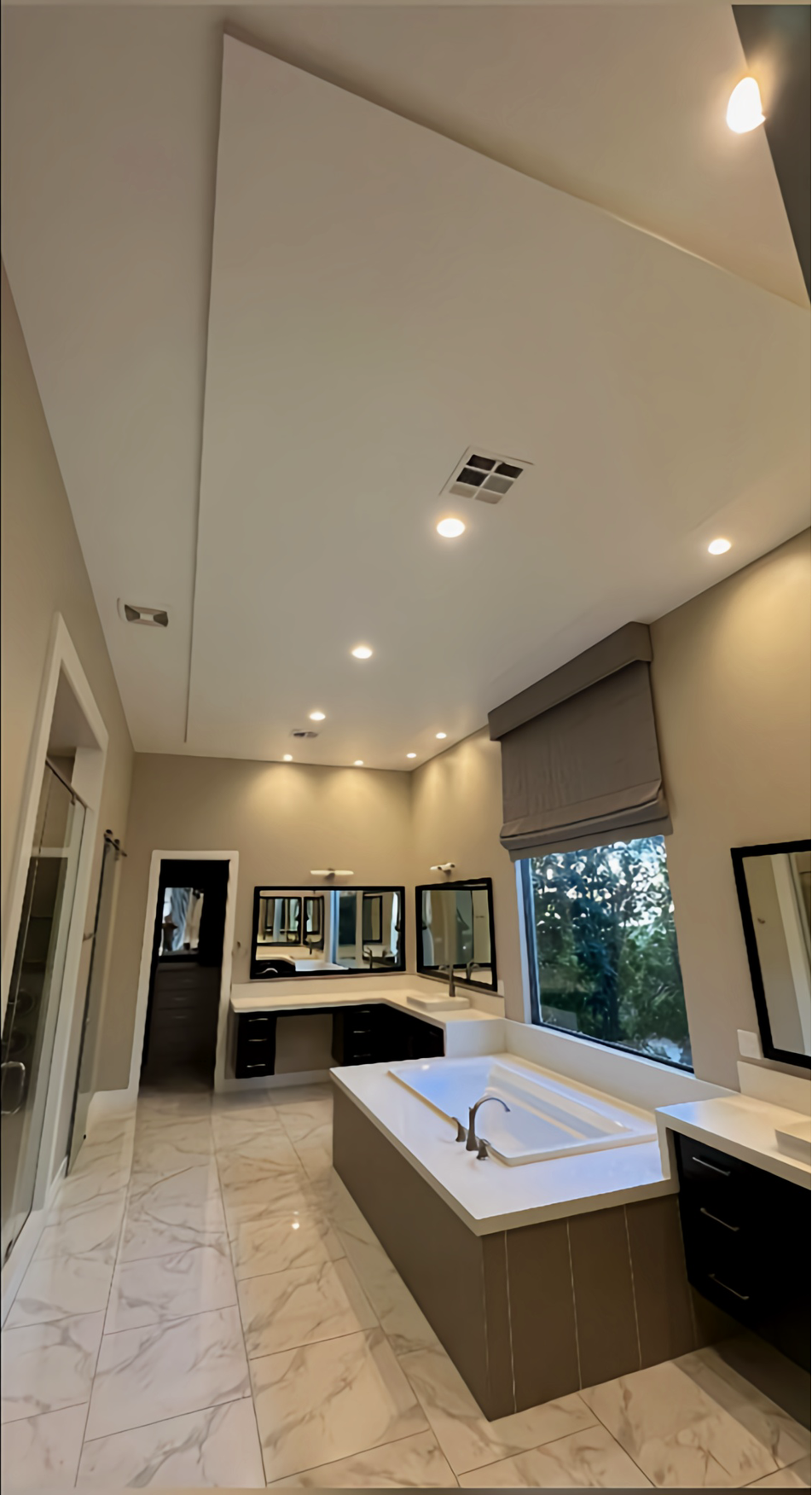 A bathroom with a toilet a sink and a bathtub