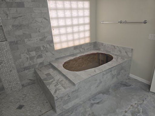There is a bathtub in the middle of the bathroom.