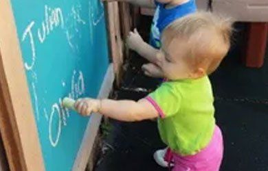 Toddlers Writing on the Board — Fort Thomas, KY — Kids & Cribs Early Childhood Enrichment Center Toddlers Writing on the Board — Fort Thomas, KY — Kids & Cribs Early Childhood Enrichment Center
