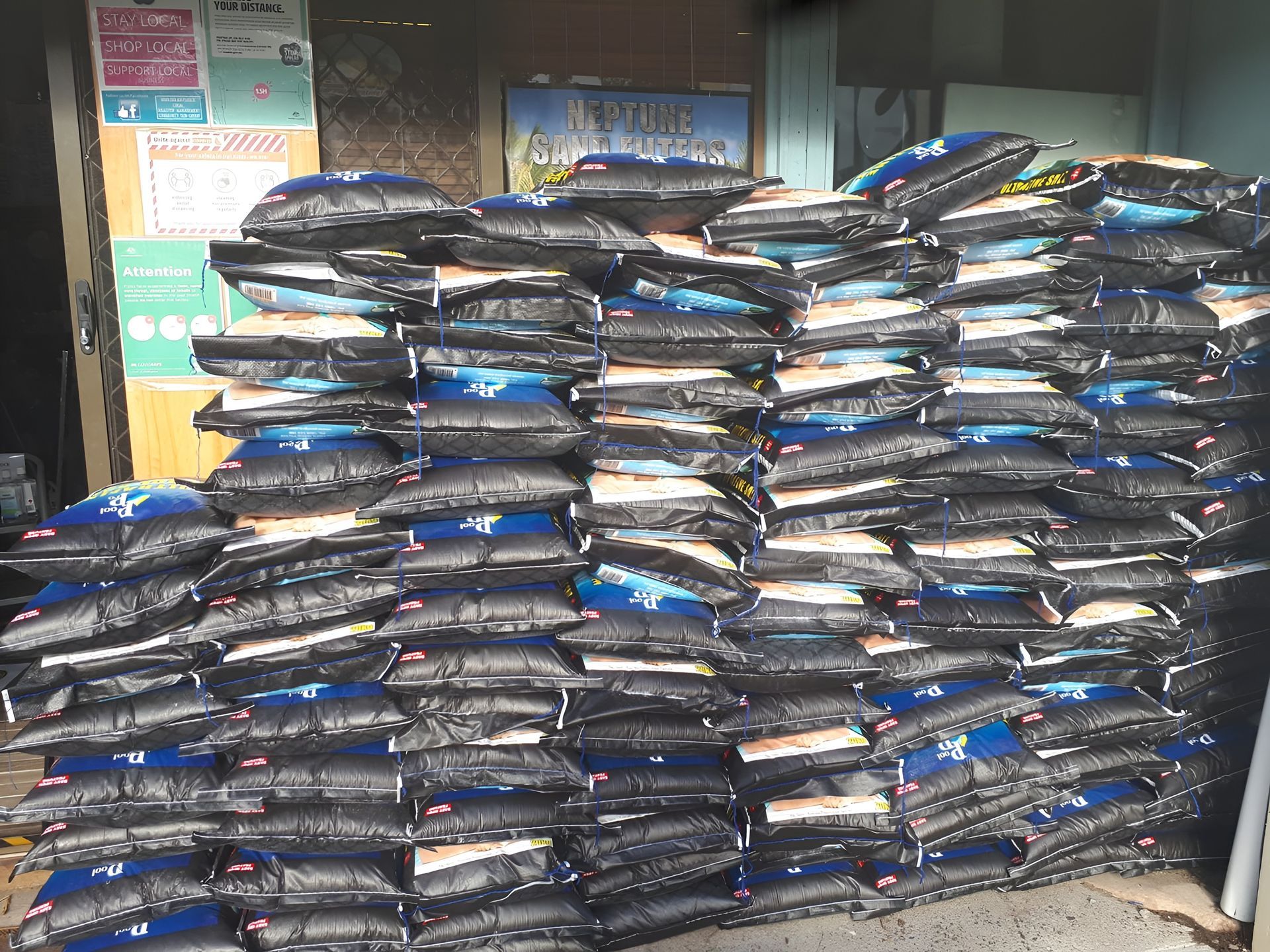 Pile of Black and Blue Bags Stacked — Landsborough Pool Supplies & Service in Beerwah, QLD