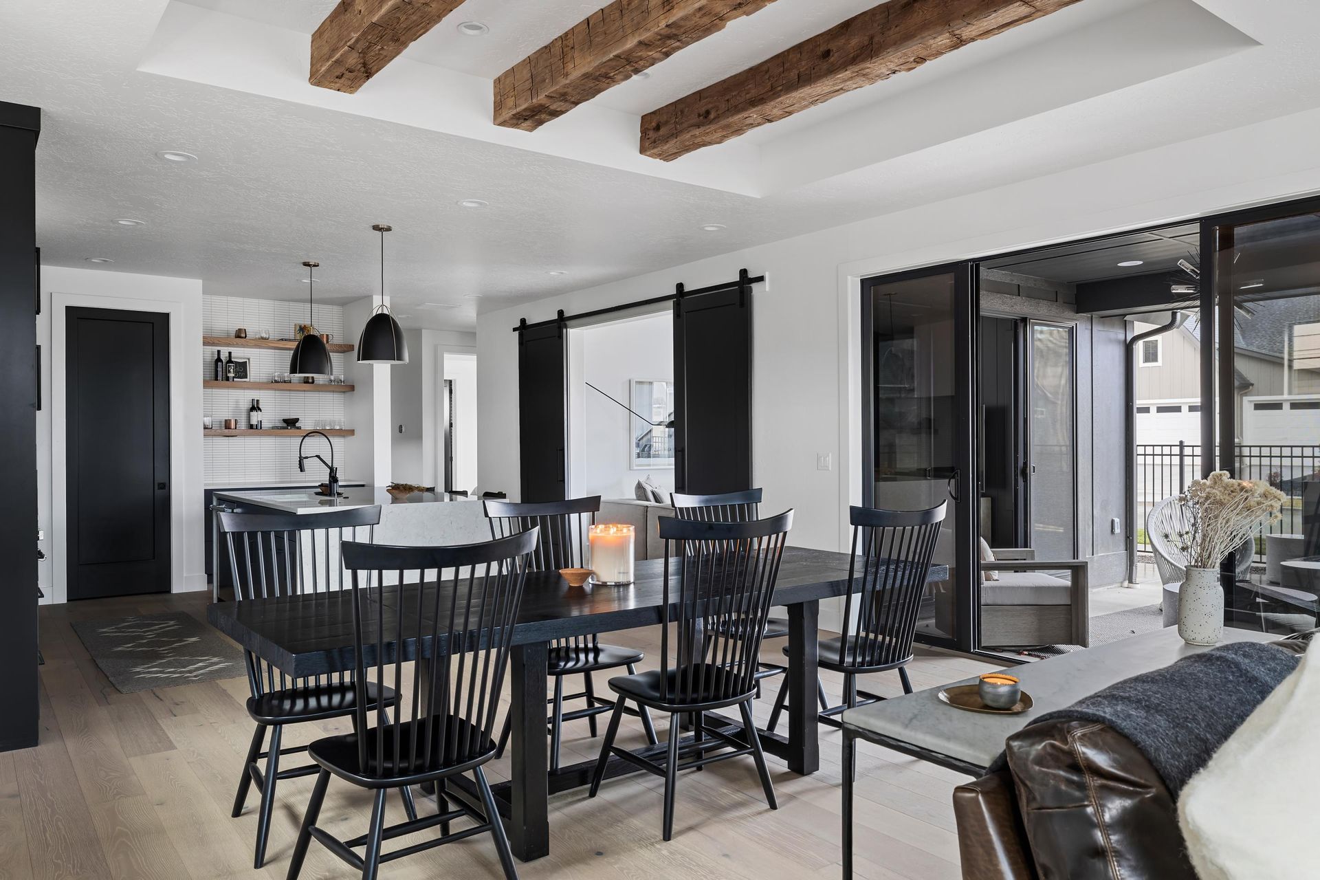 A living room with a dining table and chairs and a couch.
