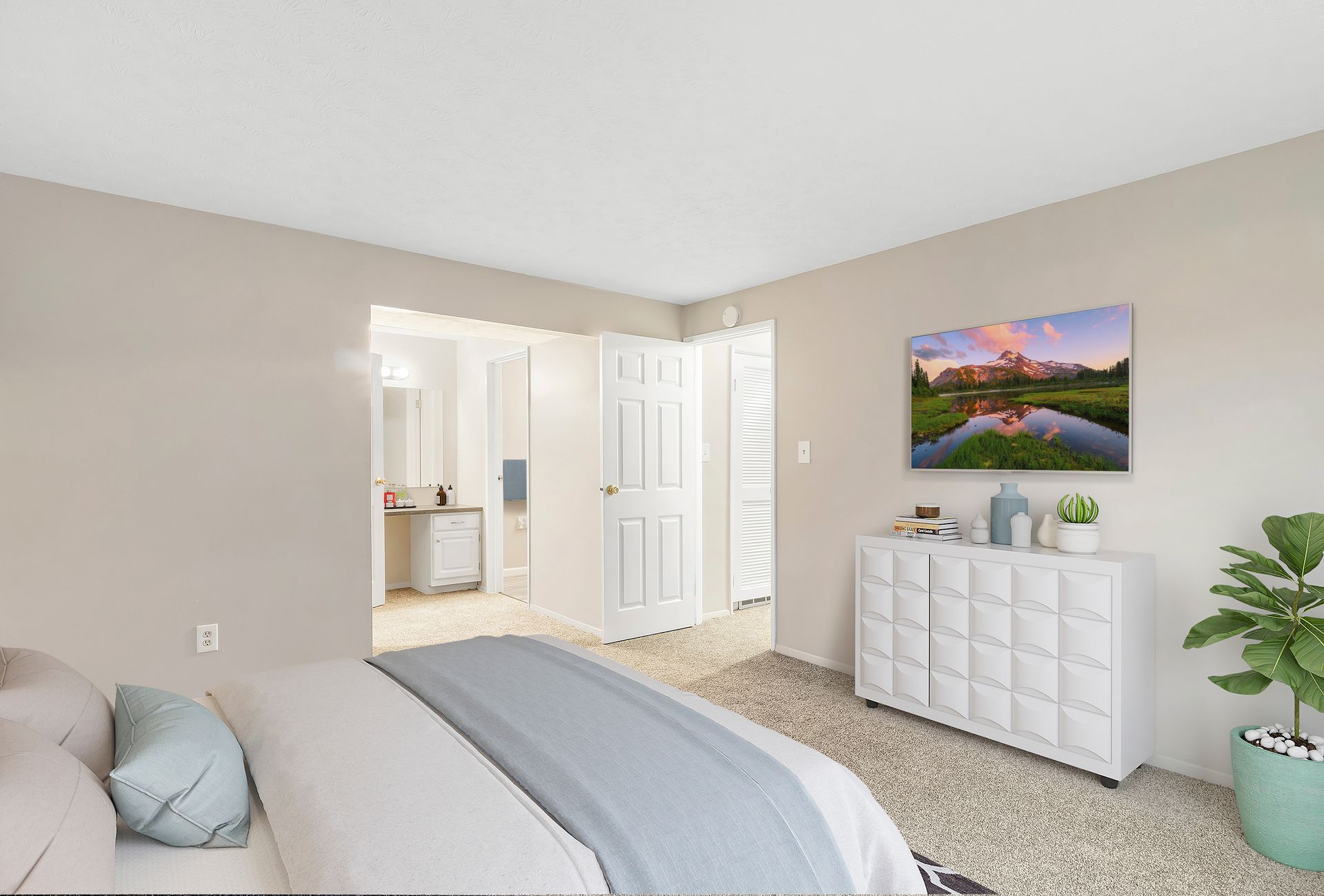 A bedroom with a large bed and a dresser.