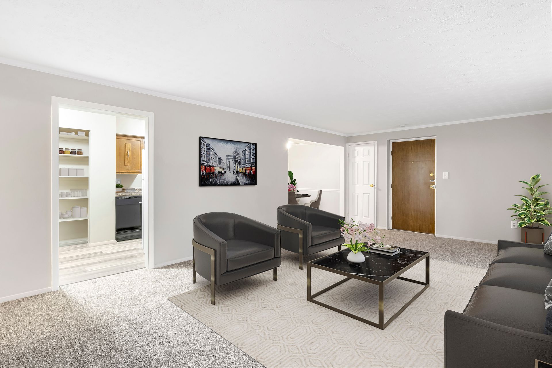 A living room with a couch , chairs , coffee table and television.