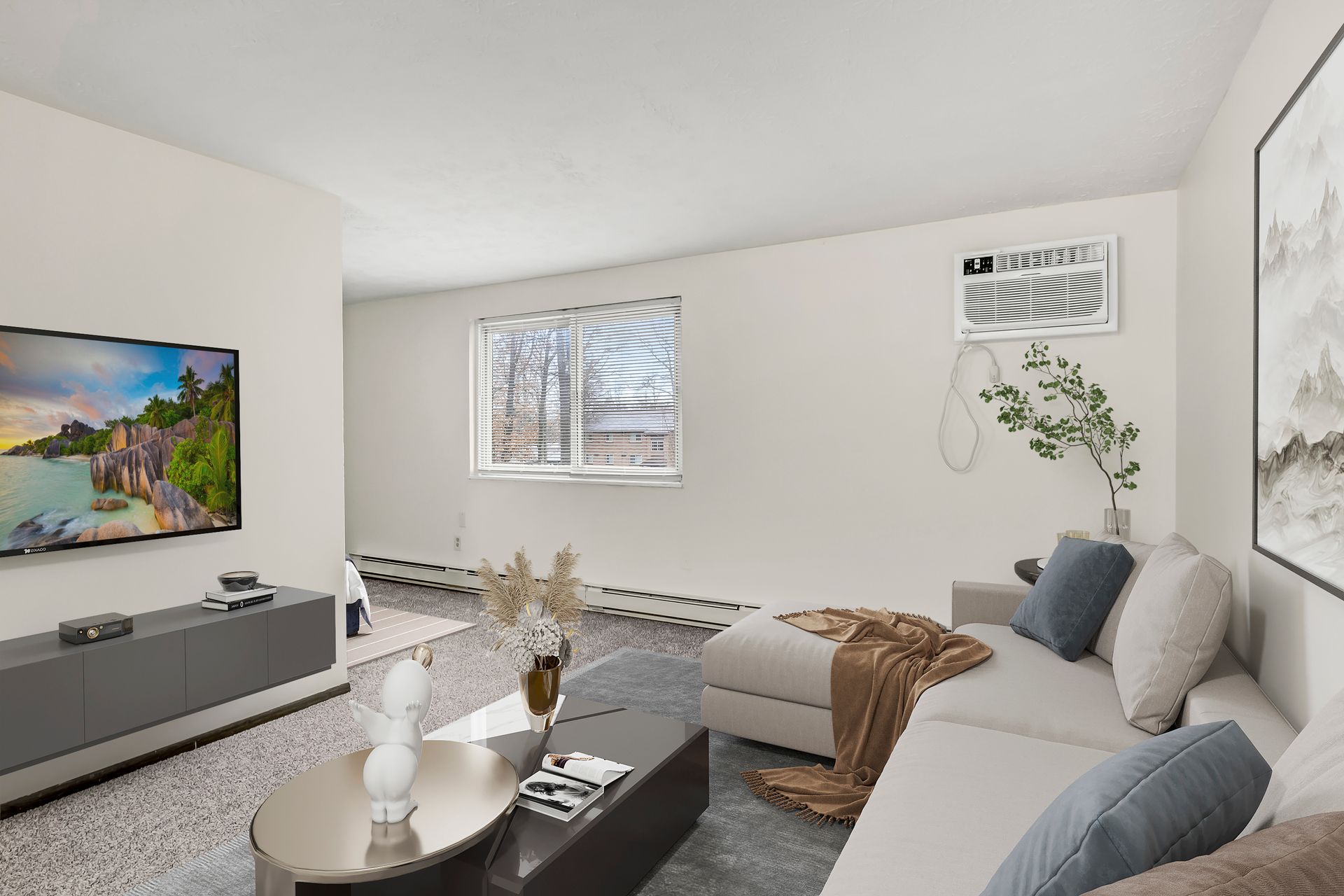 A living room with a couch and a flat screen tv.