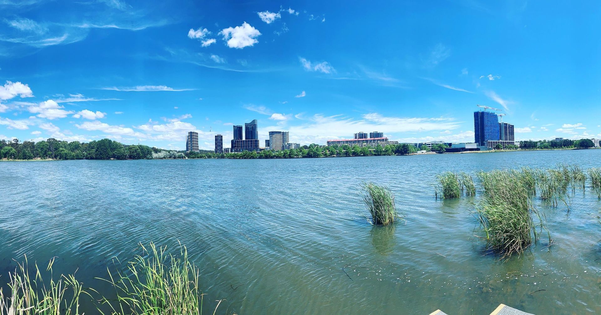 A large body of water with a city in the background.