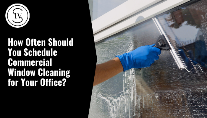 A person is cleaning a wall with a spray bottle and a cloth.