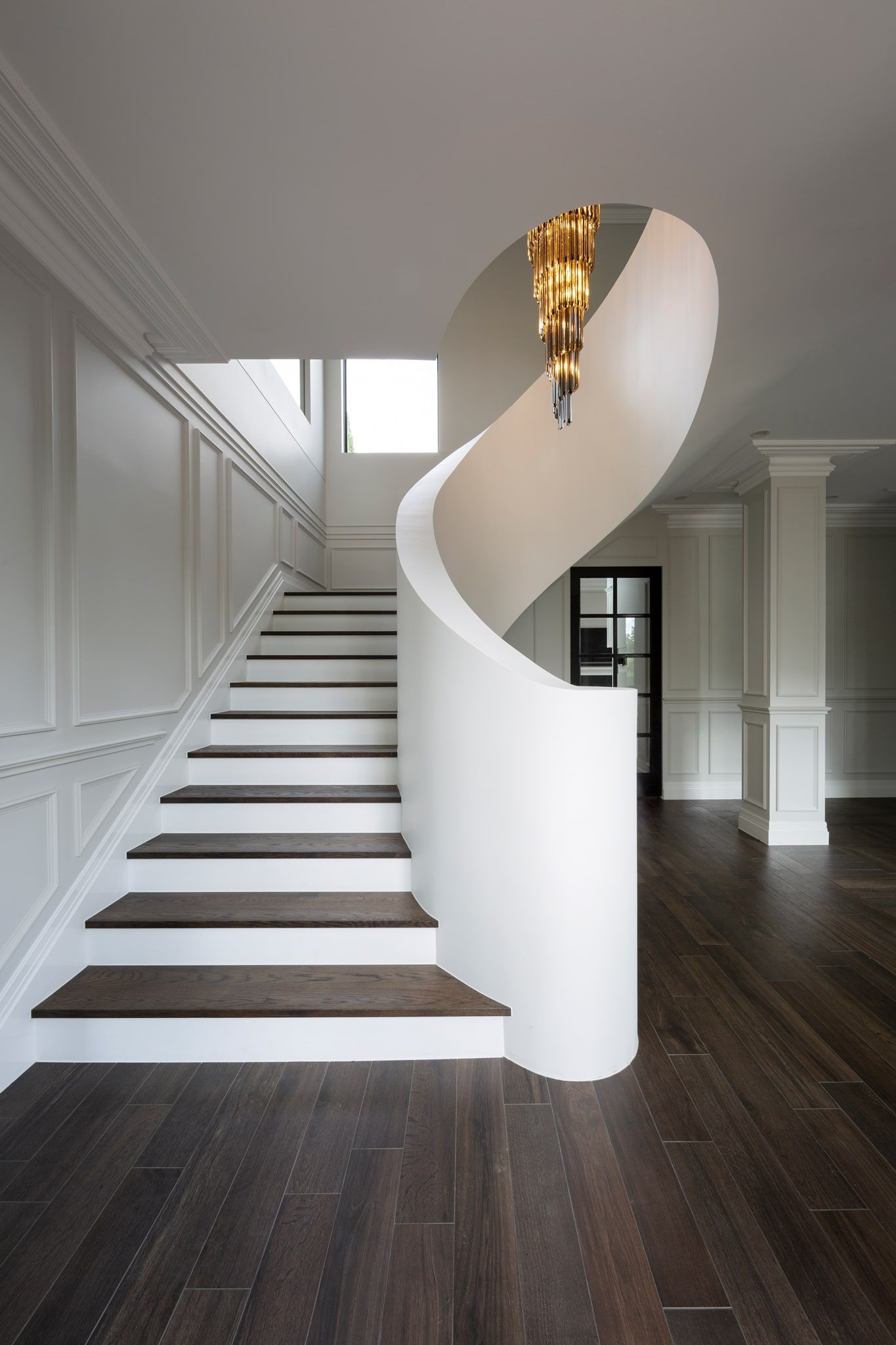 There is a spiral staircase in the middle of the room.