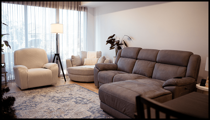 Airbnb common area with clean upholstery, styled furniture, and a spotless rug after turnover cleaning