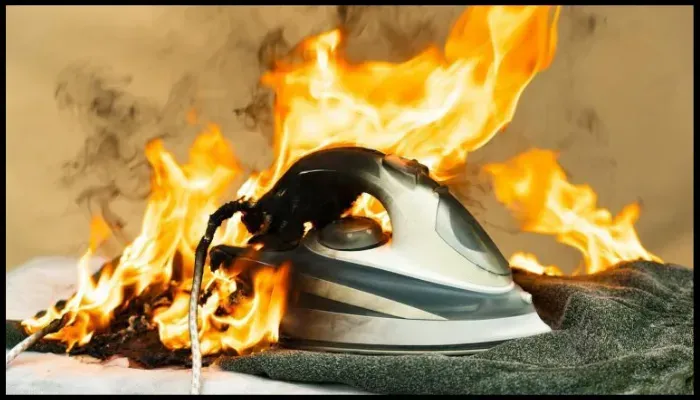 Burning iron on fire, illustrating the dangers of overheating appliances