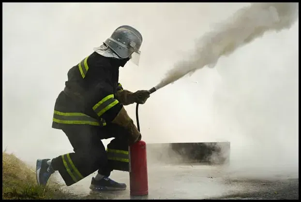 Firefighter using extinguisher