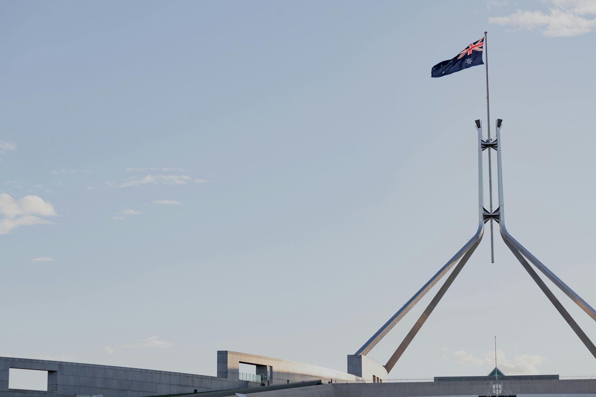 A very tall building with a flag on top of it