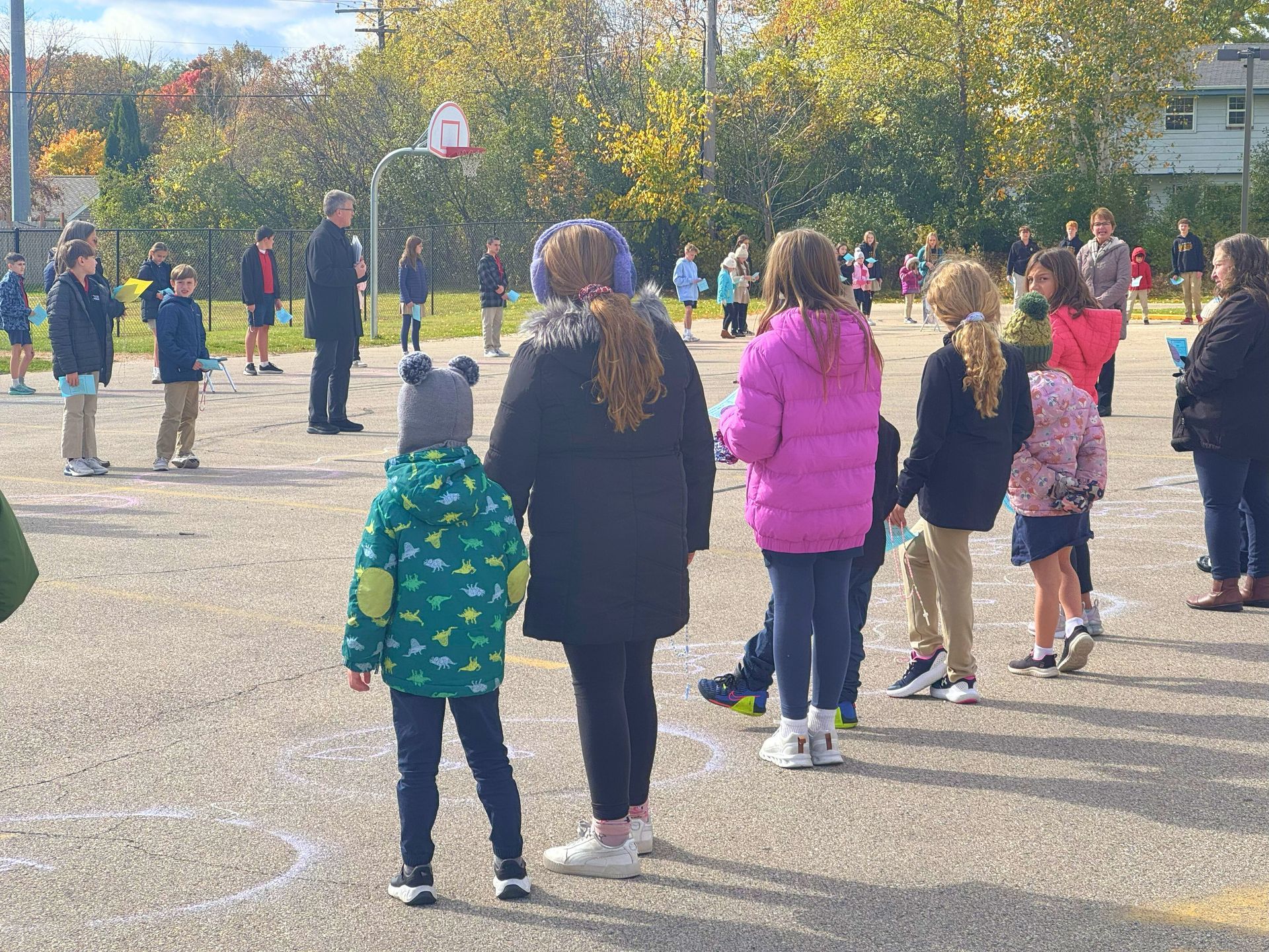 St. Leonard students pray together with older and younger class 