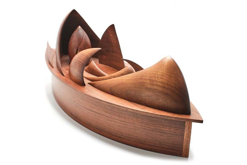A curved piece of wood with a white background