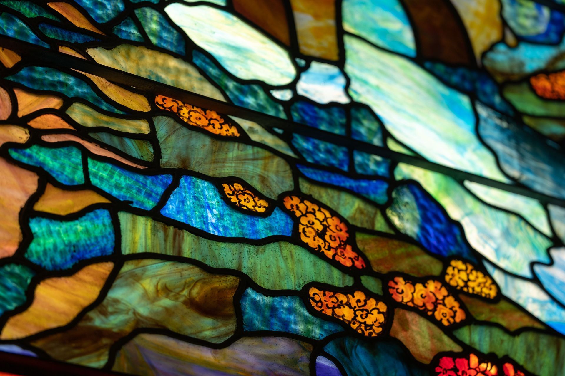 A close up of a colorful stained glass window