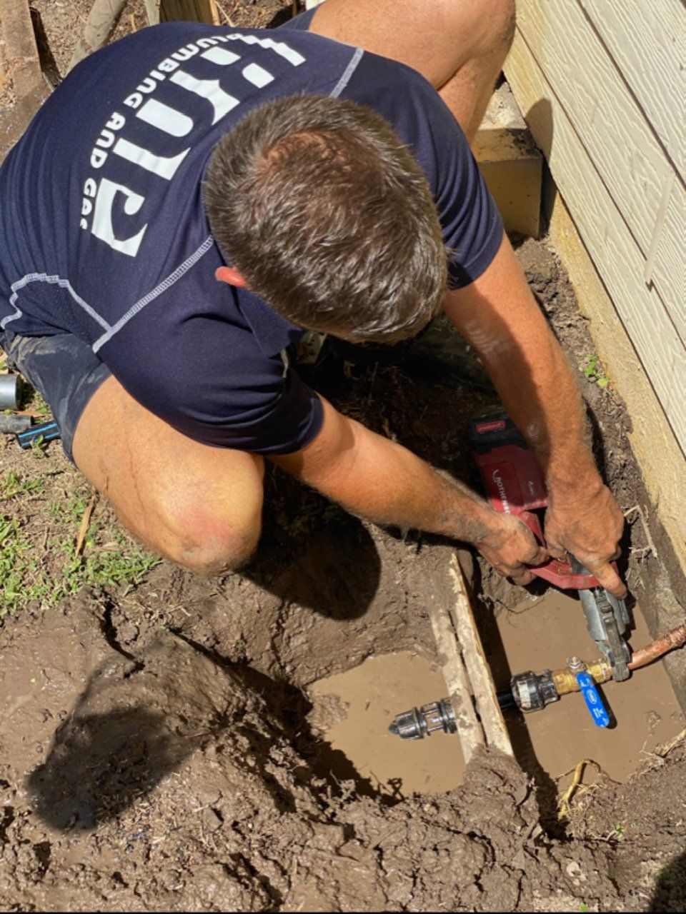 Plumbing Contractor Working On The Copper Pipe — KNP Plumbing and Gas — Airlie Beach, QLD Plumbing Contractor Working On The Copper Pipe — KNP Plumbing and Gas — Airlie Beach, QLD