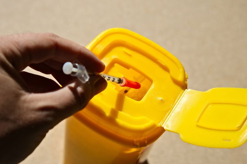 A Person Wearing Gloves Is Cleaning A Tile Floor With A Sponge — Aafco Hygiene In Wodonga, VIC