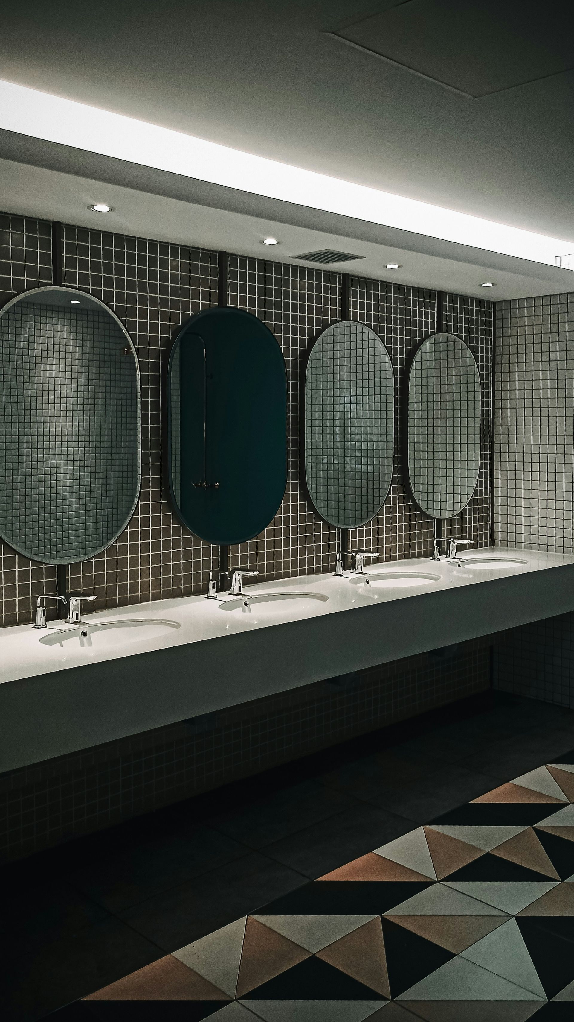 A Row Of Urinals In A Public Restroom — Aafco Hygiene In Wodonga, VIC