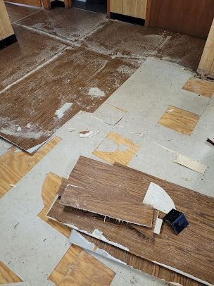 A wooden floor with a lot of pieces of wood on it.