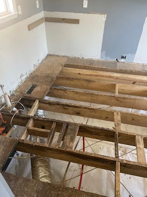 A wooden floor is being built in a room.