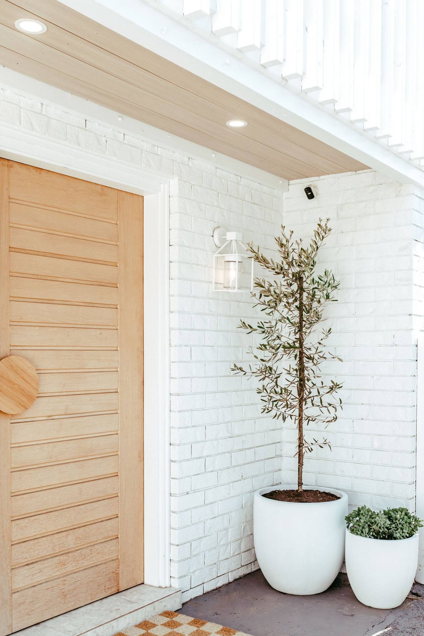 Renovated home entry with modern door and fresh interior, Newcastle NSW by Altered Building and Renovations