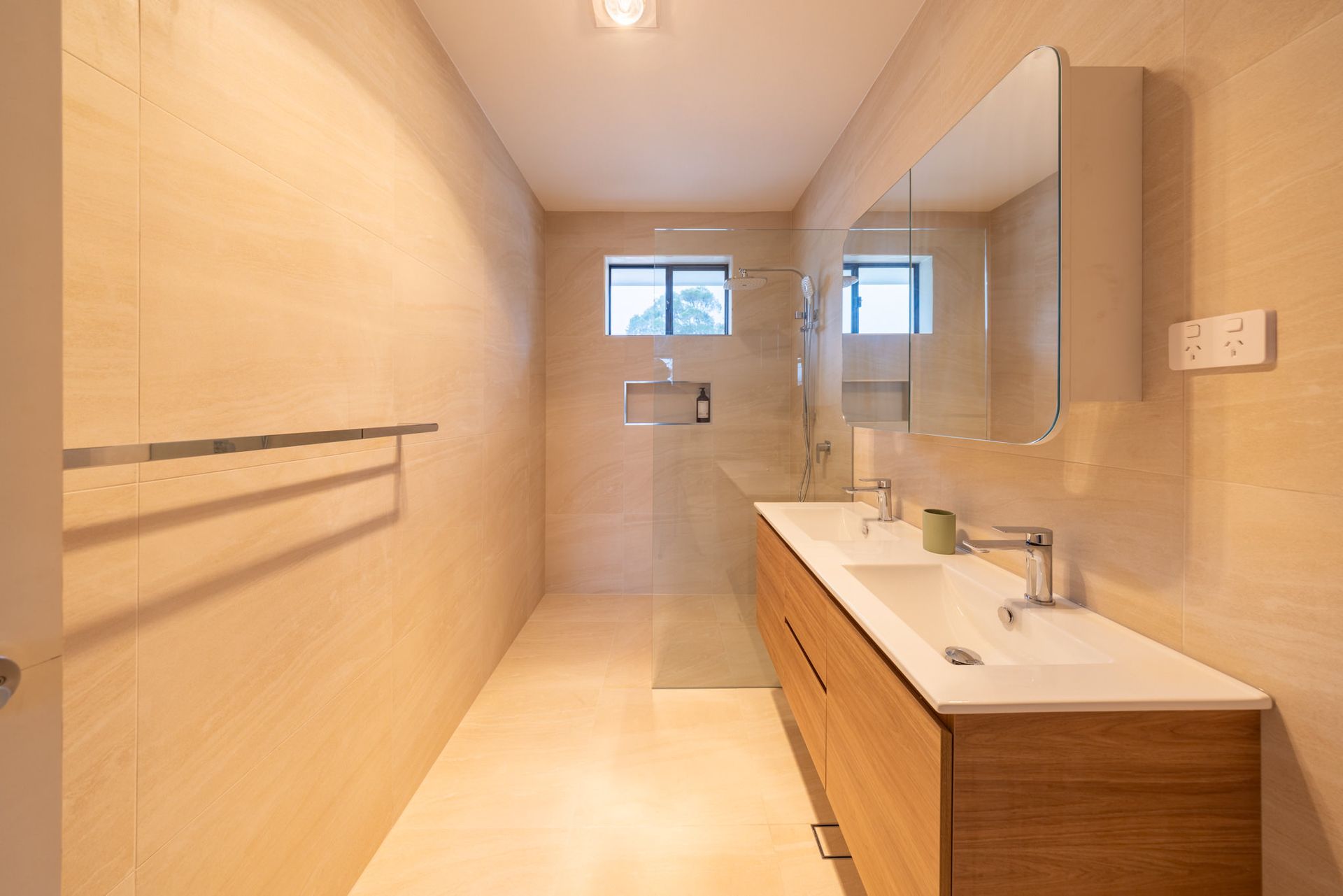 Modern bathroom renovation with quality tiling and fixtures, Newcastle NSW by Altered Building and Renovations