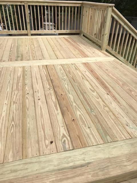 Wooden deck with railings.