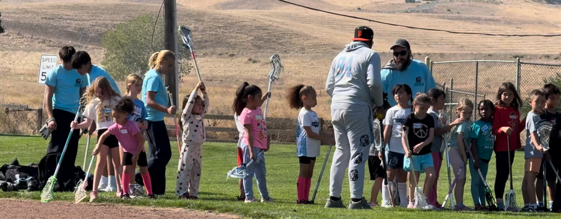 Youth lacrosse players practicing at a fall clinic in East Contra Costa County.