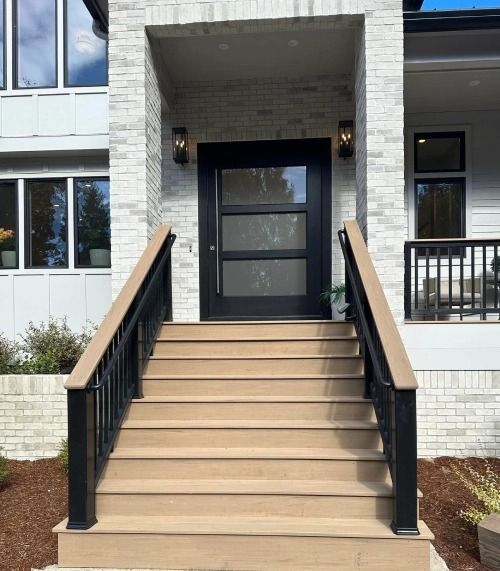 A house with stairs leading up to the front door